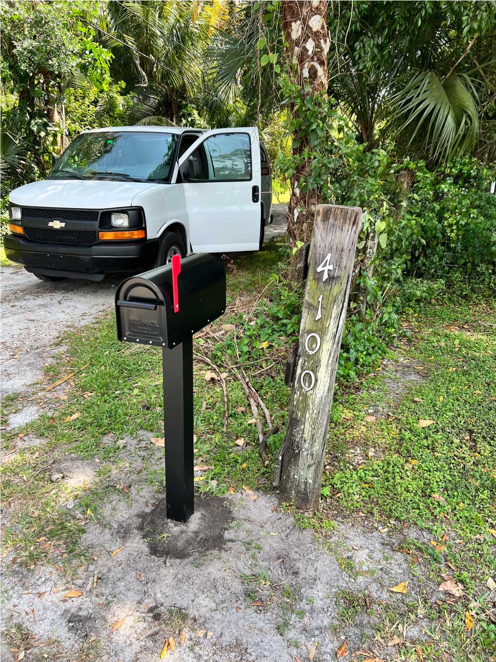 New mailbox post installed along a residential street