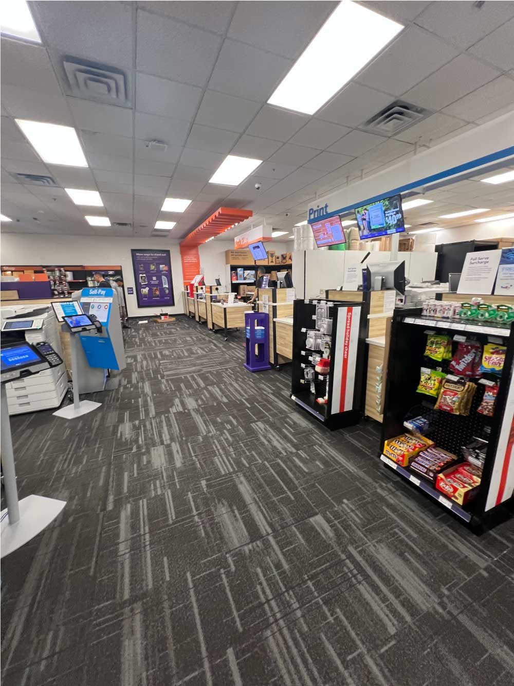 Retail store interior with new flooring and ceiling lighting installed