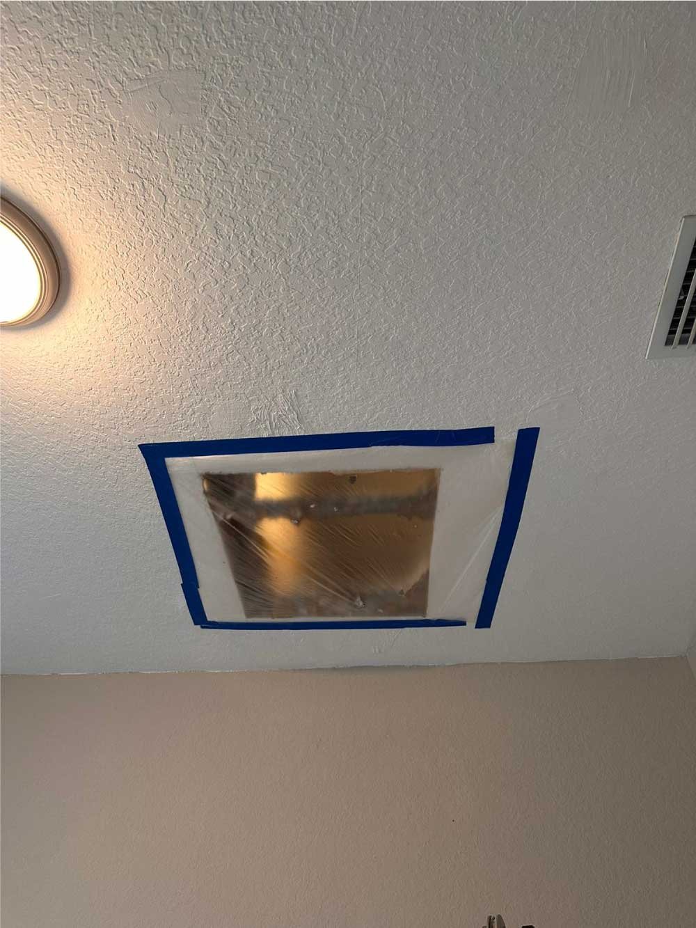 Drywall ceiling patch taped and prepped for finishing