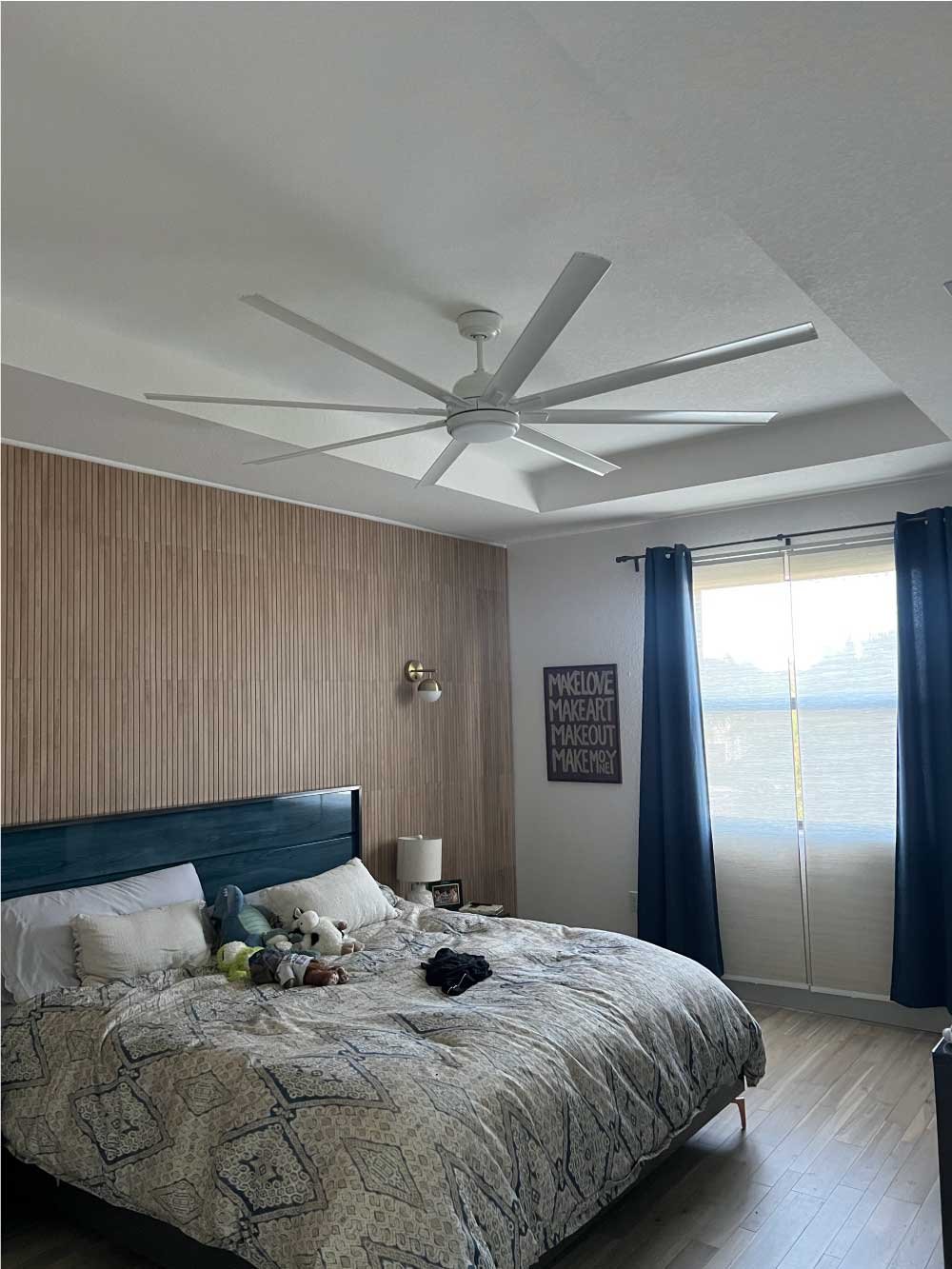 Large ceiling fan installed in a master bedroom