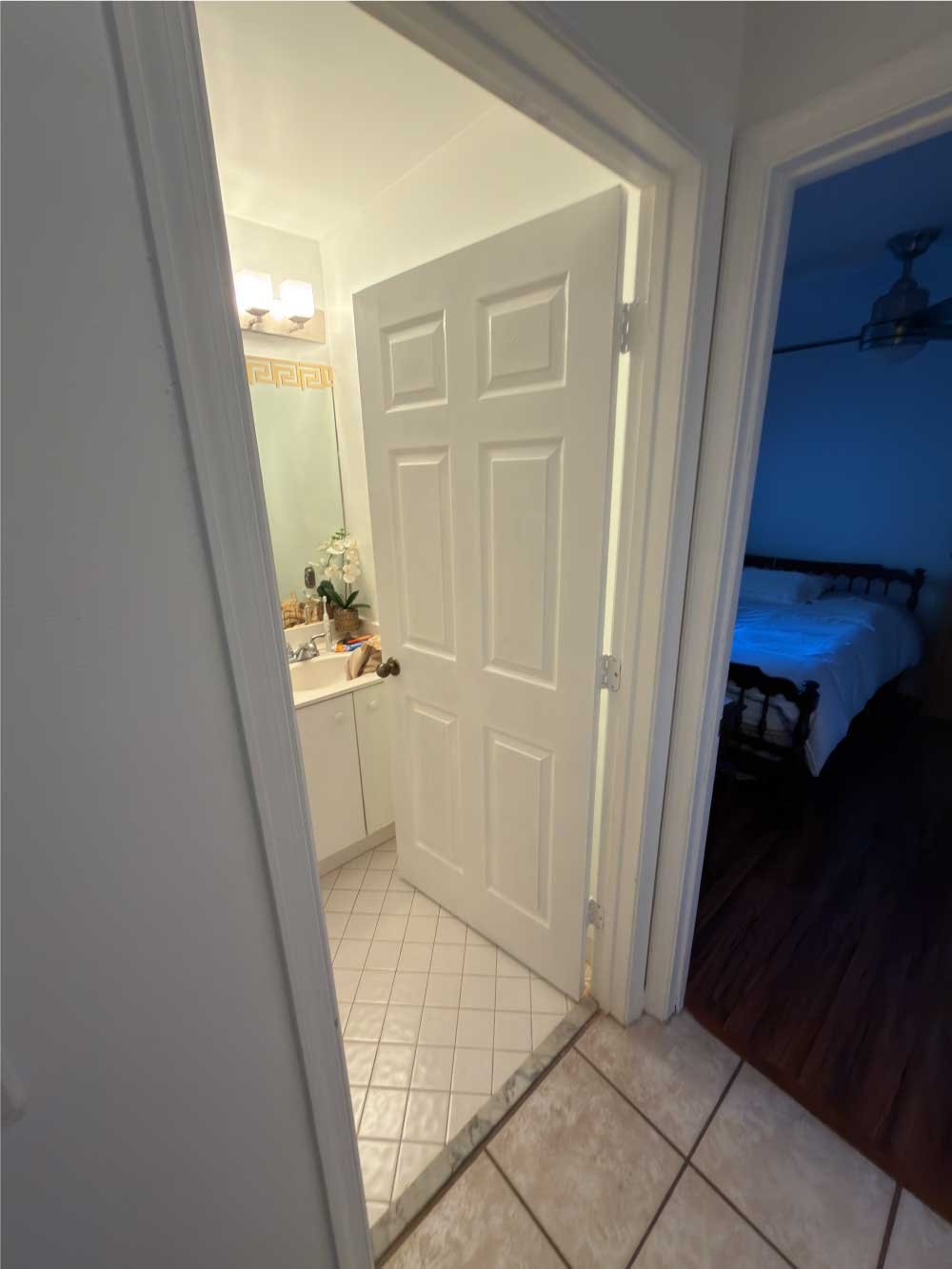 Hallway with newly installed interior doors to a bathroom and bedroom